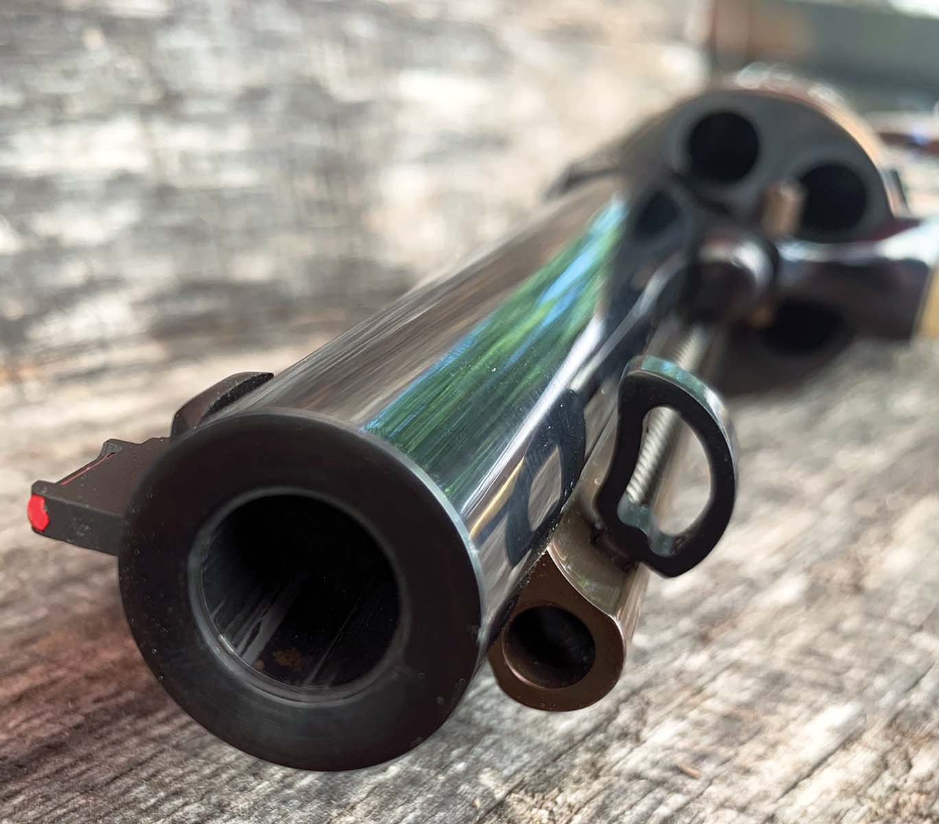 The ejector rod button and the crowned barrel by RW Grip Frames.